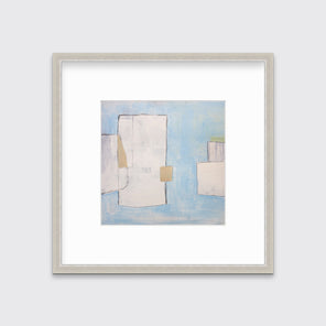 A blue, white and beige abstract print in a silver frame with a mat hangs on a white wall.