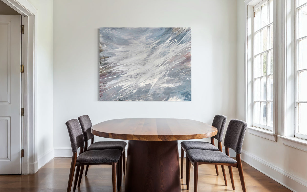 Dining room with a round wooden table and four chairs, featuring an original Teo Guererra abstract painting on the wall.