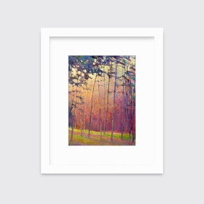 A red, orange and blue abstract tree landscape print in a white frame with a mat hangs on a white wall.