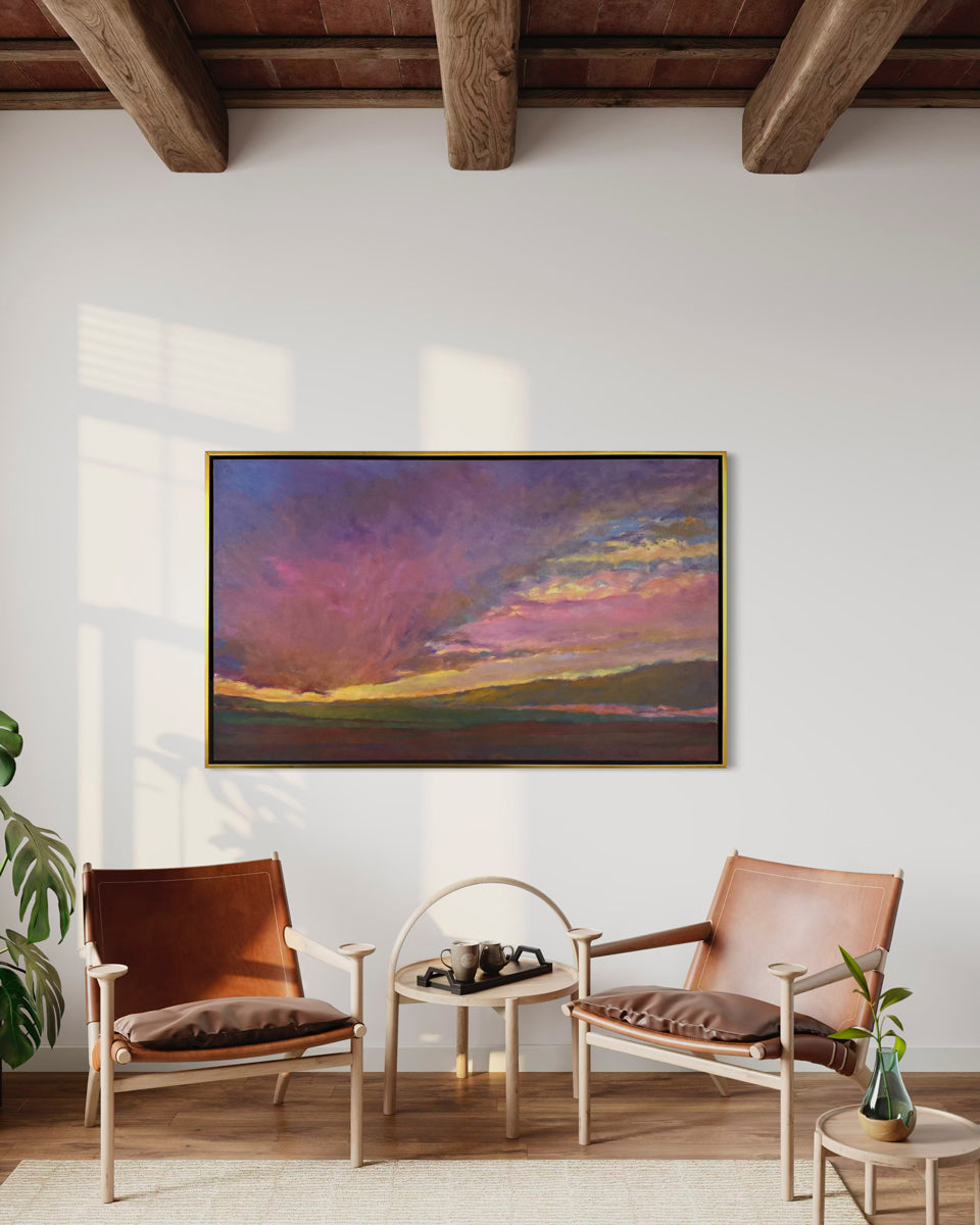 Living room with two brown chairs, a small table, and a colorful abstract painting on the wall.