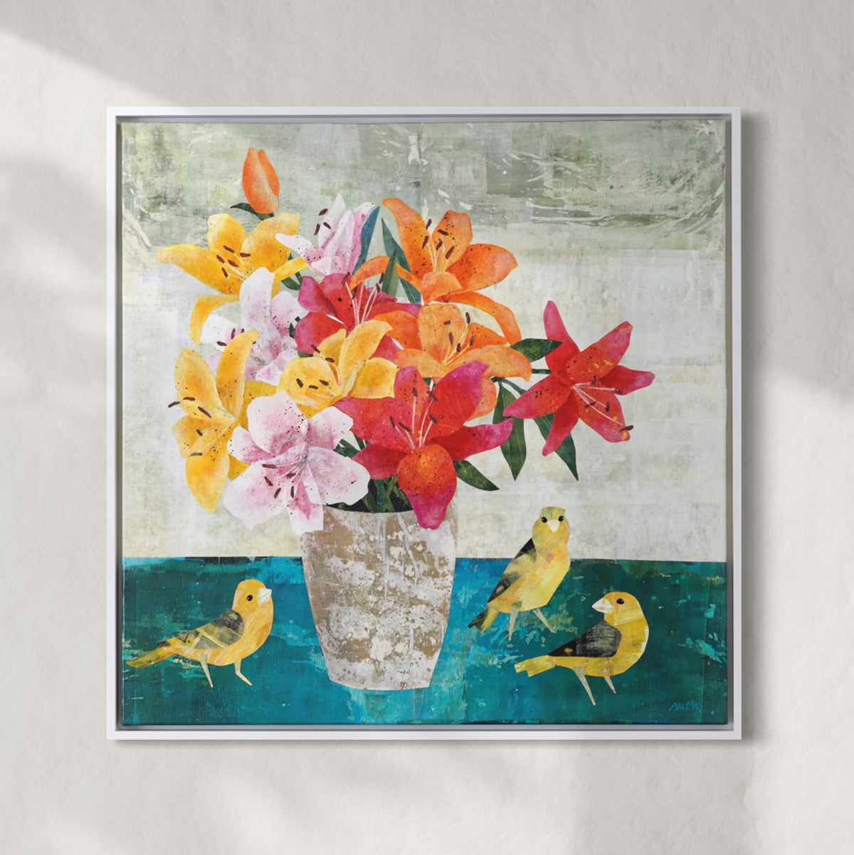 A square framed collage painting featuring a bouquet of colorful lilies in a textured vase, with three small yellow birds on a teal surface against a light gray background.