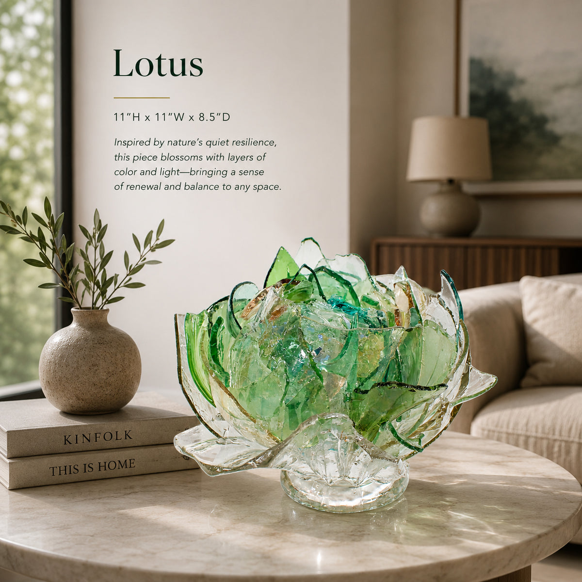 Recycled green, clear and aqua, amber Glass sculpture of a flower on a table with books and a lamp in the background
