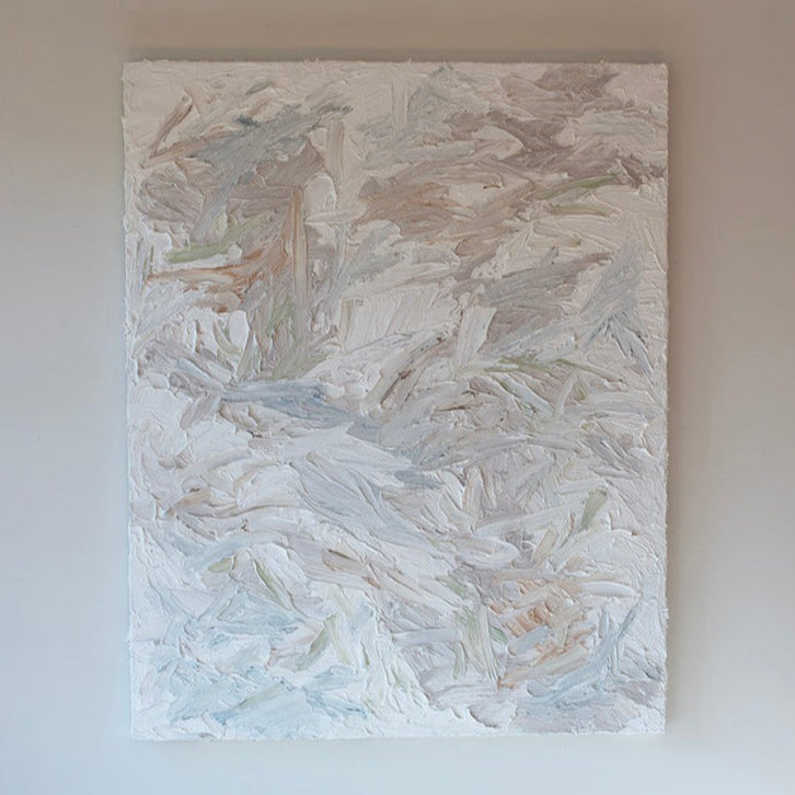 An abstract painting with thickly textured brushstrokes of beige, green, orange, and blue is hung on a gallery wall.