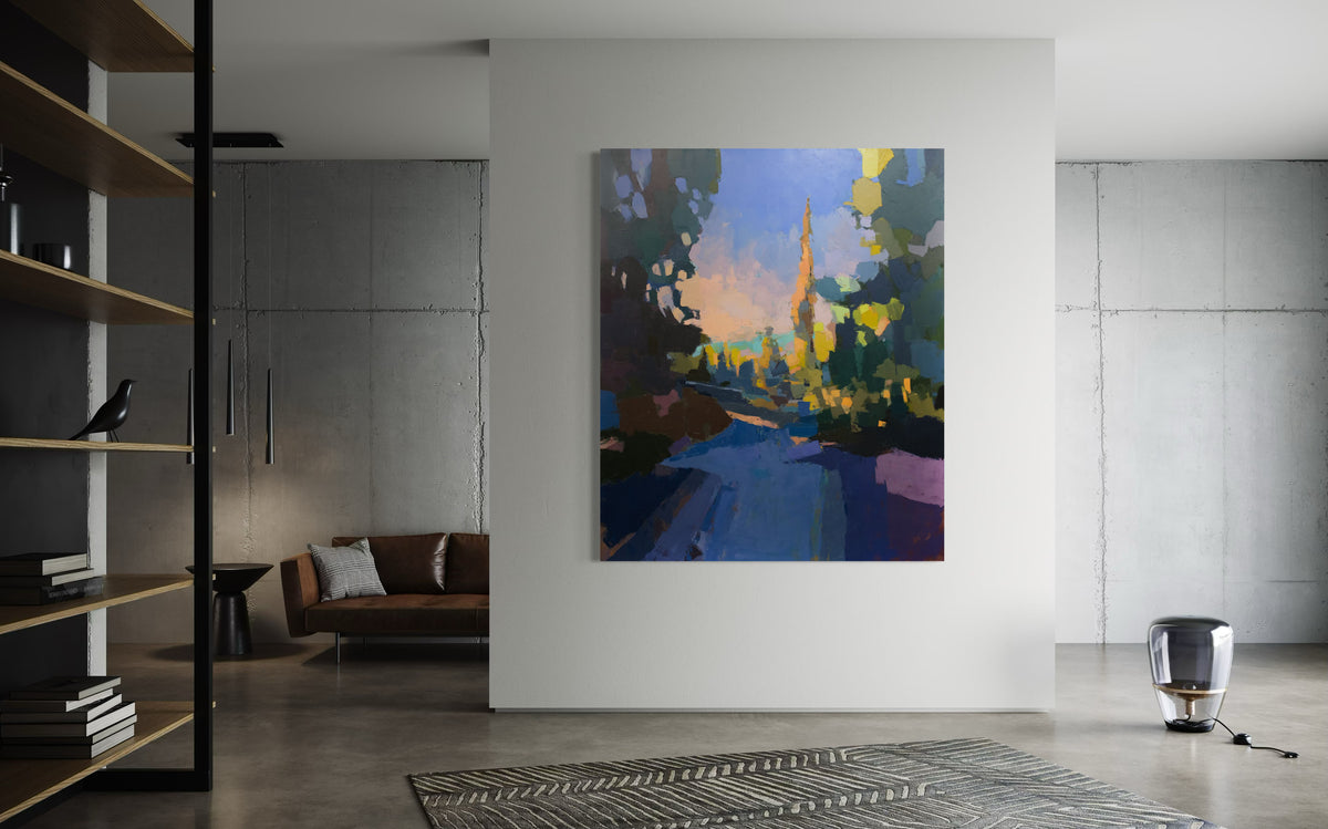A large blue and yellow abstracted landscape painting hangs on a white wall in a modern apartment.