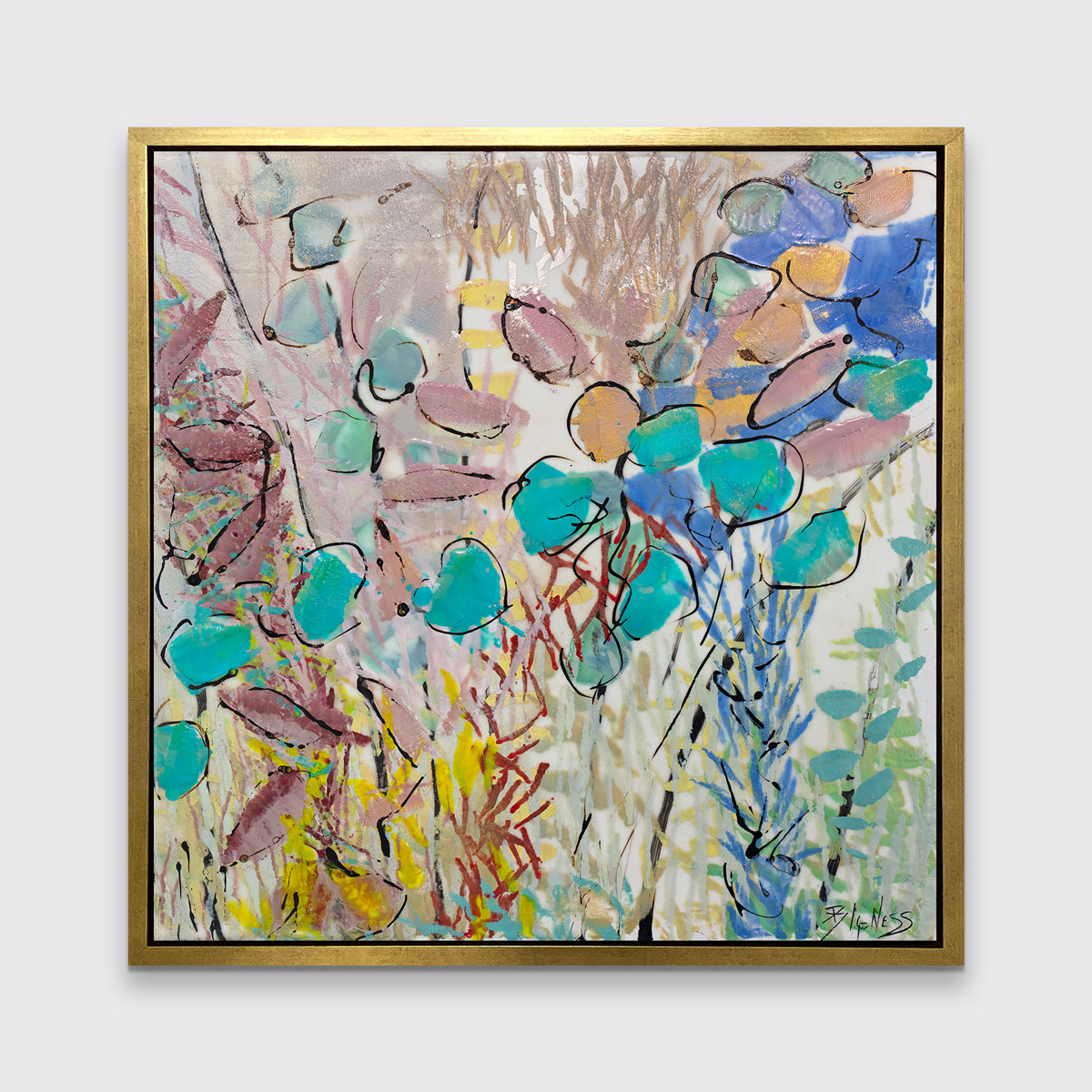 A blue, pink and yellow abstract floral print in a gold floater frame hangs on a white wall.