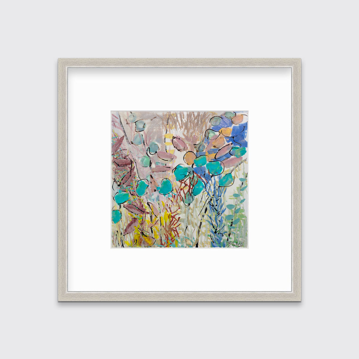 A blue, pink and yellow abstract floral print in a silver frame with a mat hangs on a white wall.