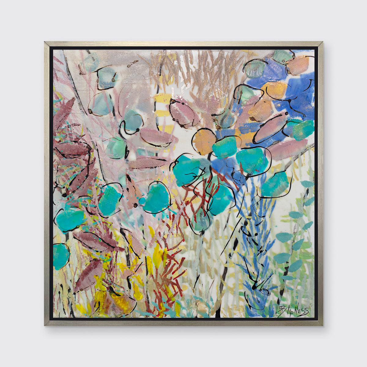 A blue, pink and yellow abstract floral print in a silver floater frame hangs on a white wall.