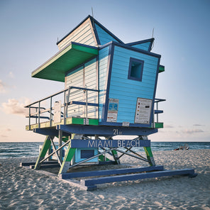 A coastal photograph of a blue and green Miami lifeguard stand in Miami Beach, Florida. 