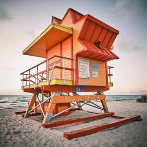 A photograph of an orange Miami Beach lifeguard stand on a beach. 