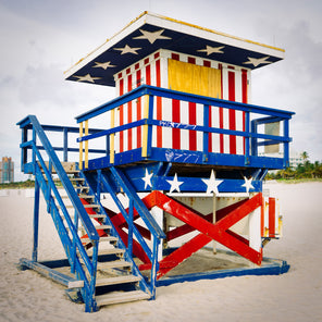 A photograph of an American flag-themed lifeguard stand on Miami Beach. 