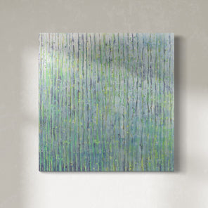 A painting with purple and green undertones and striated with silver lines hangs on a gallery wall. 