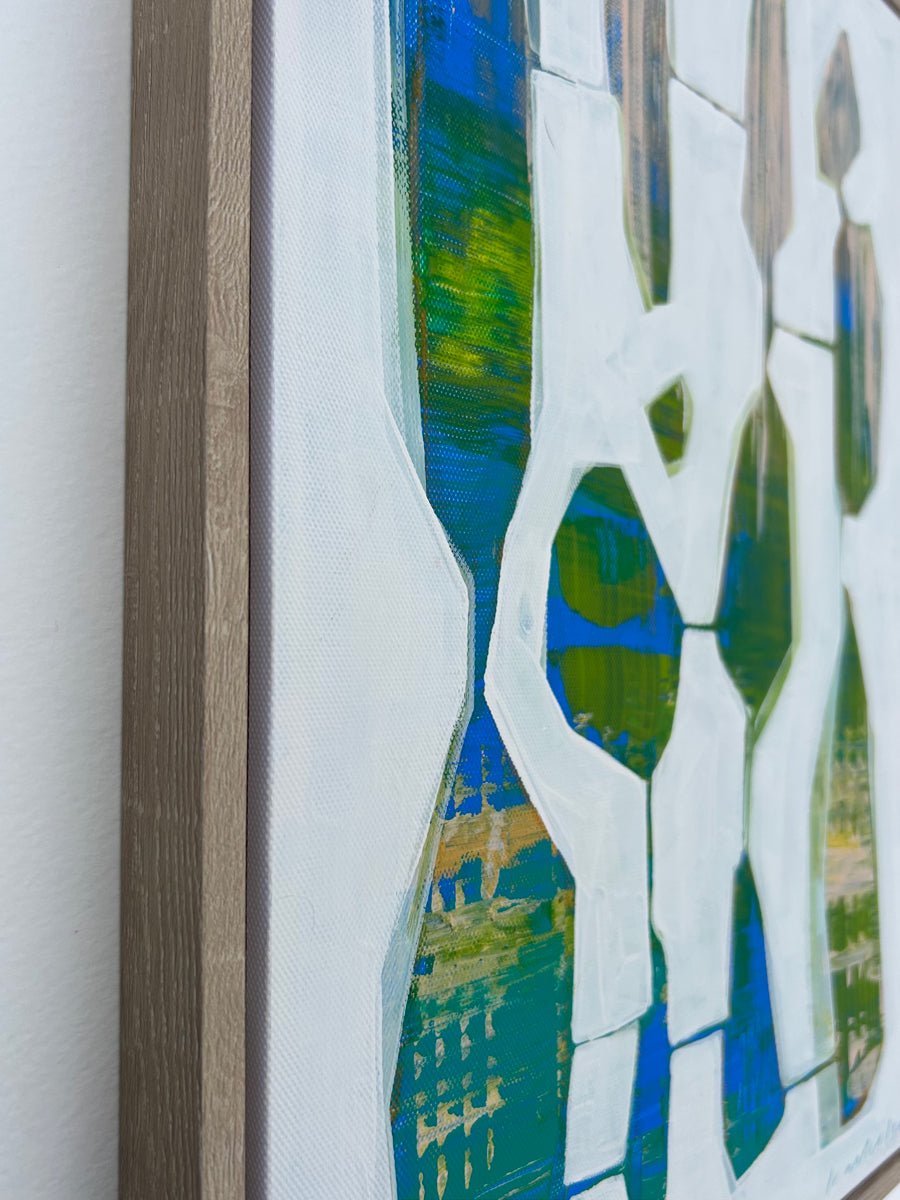 A detail of a framed abstract painting by Kayla Ackelson. 