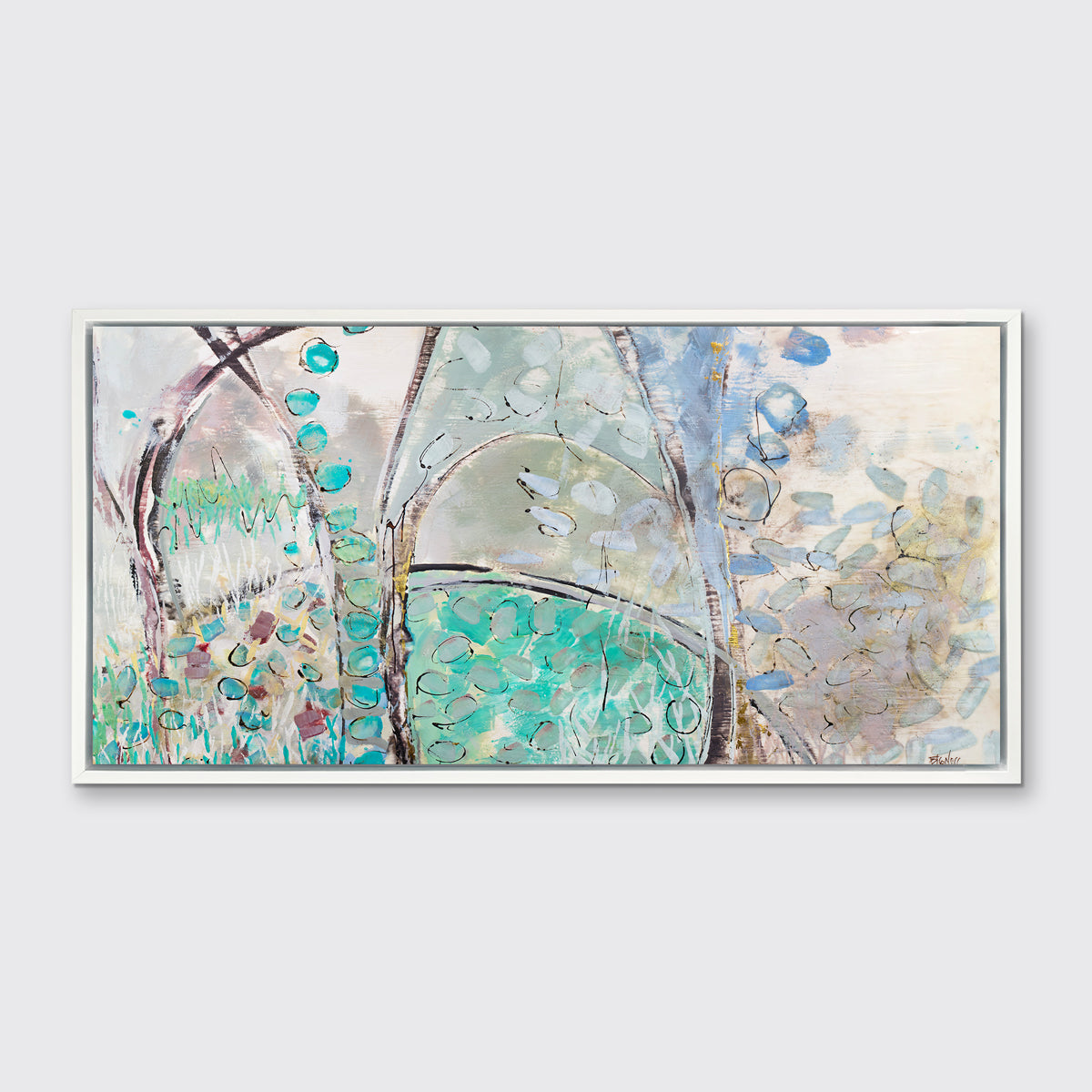 A teal, beige and mauve abstract landscape print in a white floater frame hangs on a white wall.