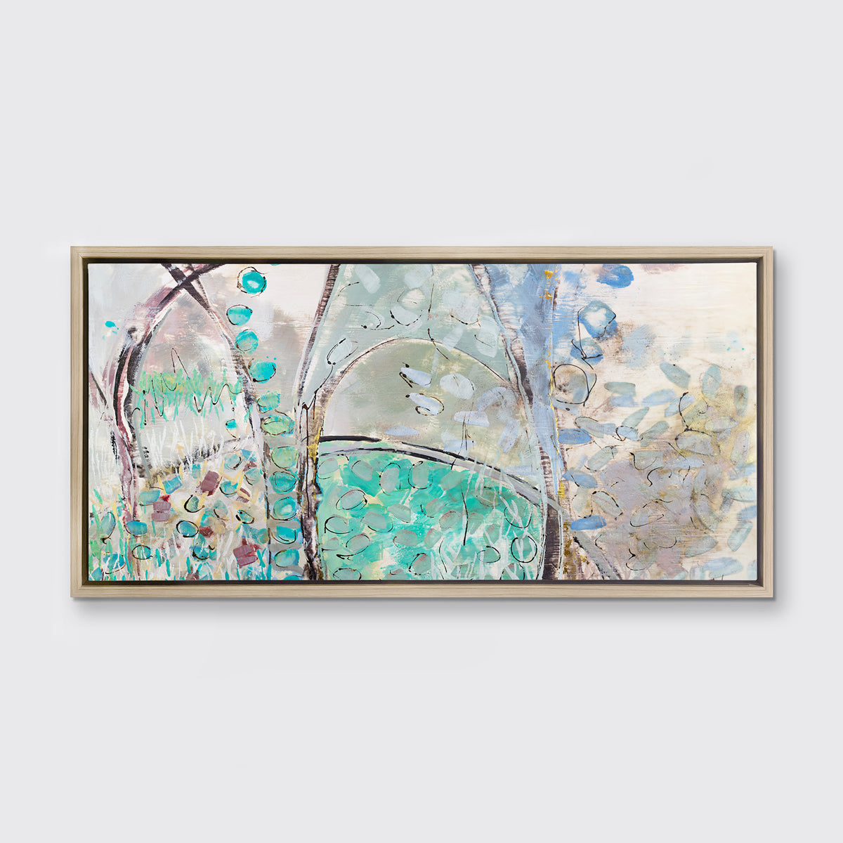 A teal, beige and mauve abstract landscape print in a white oak wood floater frame hangs on a white wall.