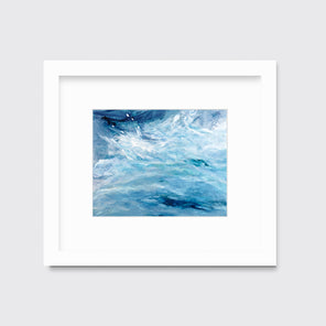 A blue, teal and white abstract print in a white frame with a mat hangs on a white wall.