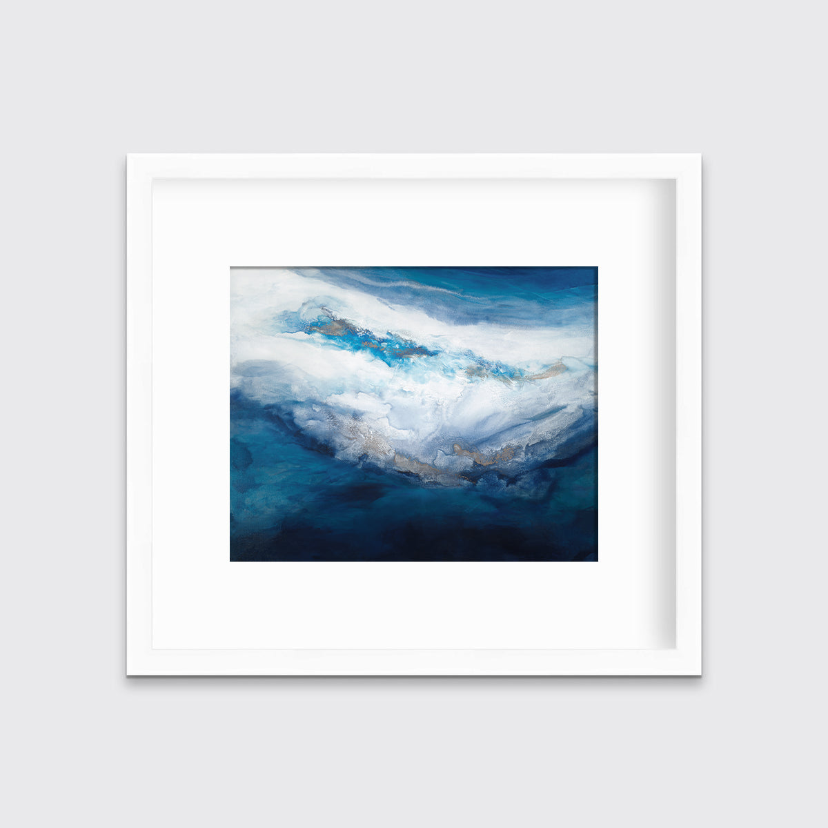 A blue, white, gold and teal abstract print in a white frame with a mat hangs on a white wall.