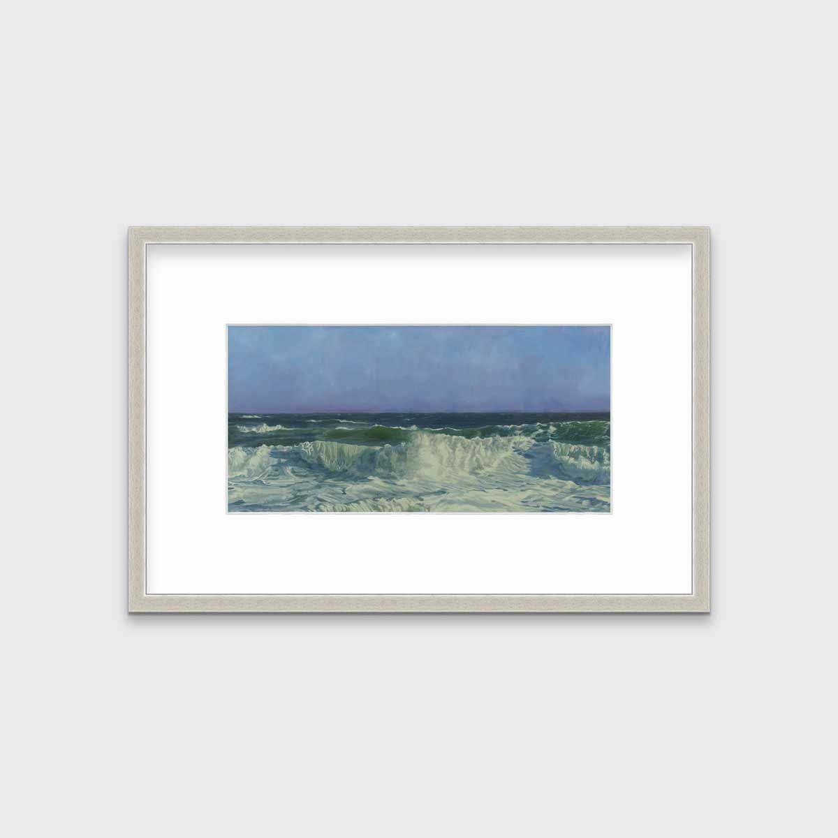 A blue, teal, white and light green abstract water wave print in a silver frame with a mat hangs on a white wall.