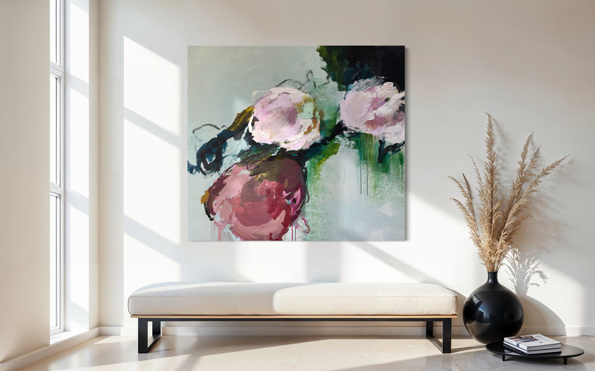 Abstract floral painting on a wall in a modern living room.