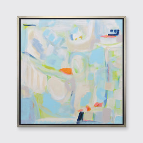 A beige, light blue, light green and orange abstract print in a silver floater frame hangs on a white wall.
