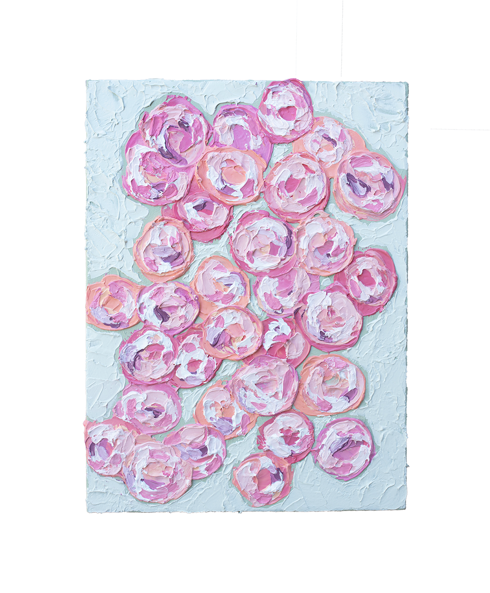 A close up of a very textured abstract painting with celadon background and circle type abstract flowers in pink, peach, plum and white hangs on a white wall.