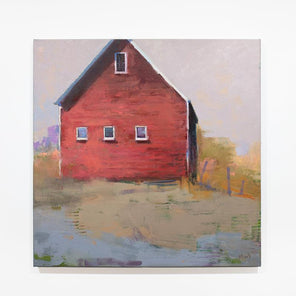 A green and slate blue abstract landscape painting with a red barn hangs on a white wall.