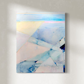 A pink and blue abstract painting hangs on a white wall. 