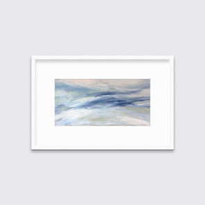 A blue, white and light green abstract print in a white frame with a mat hangs on a white wall.