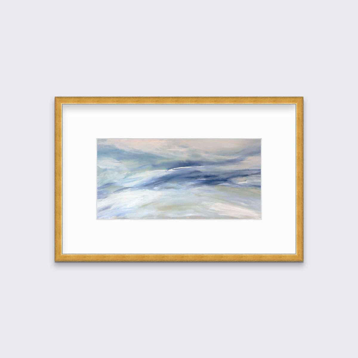 A blue, white and light green abstract print in a gold frame with a mat hangs on a white wall.