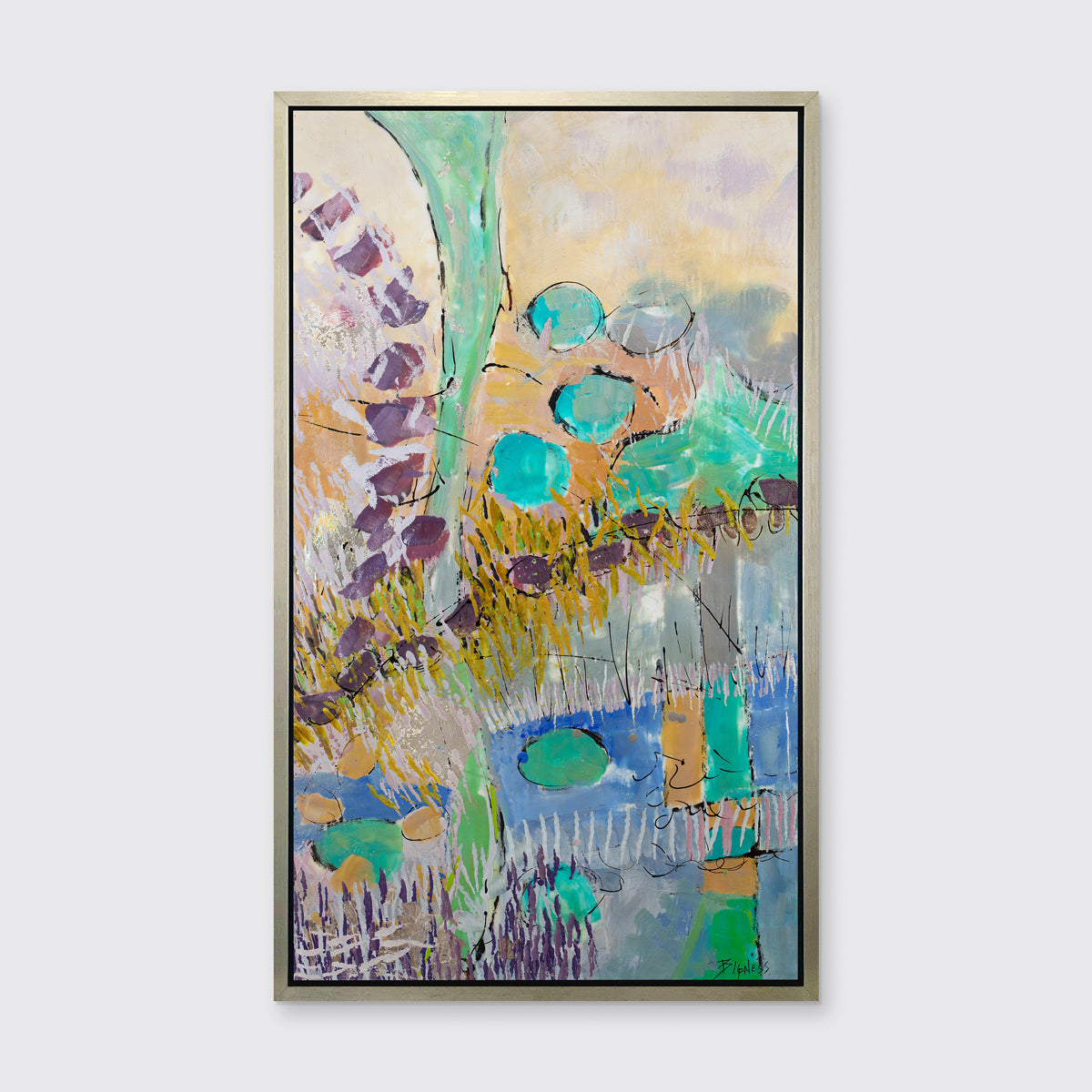 A teal, orange, purple and yellow abstract landscape print in a silver floater frame hangs on a white wall.