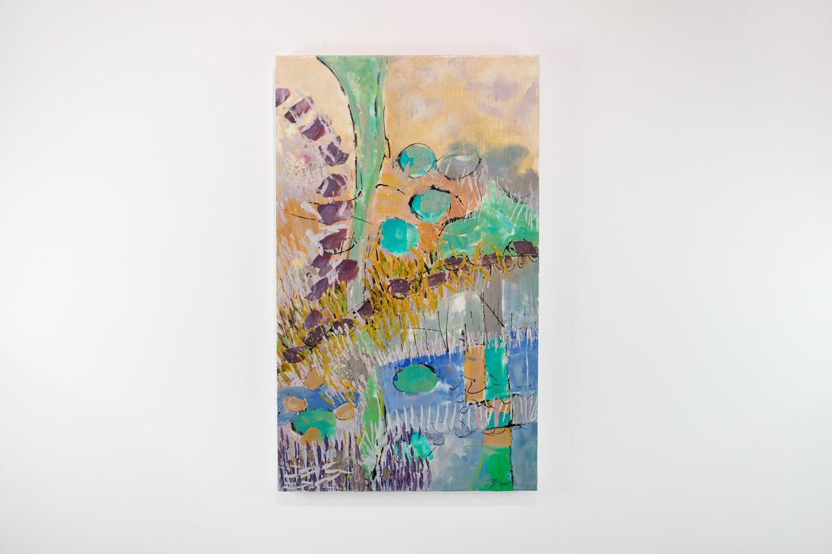 A colorful orange and turquoise abstract painting hangs on a white wall.