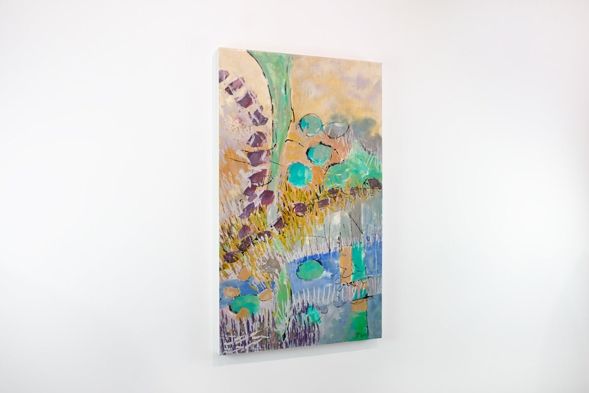 A colorful orange and turquoise abstract painting hangs on a white wall.