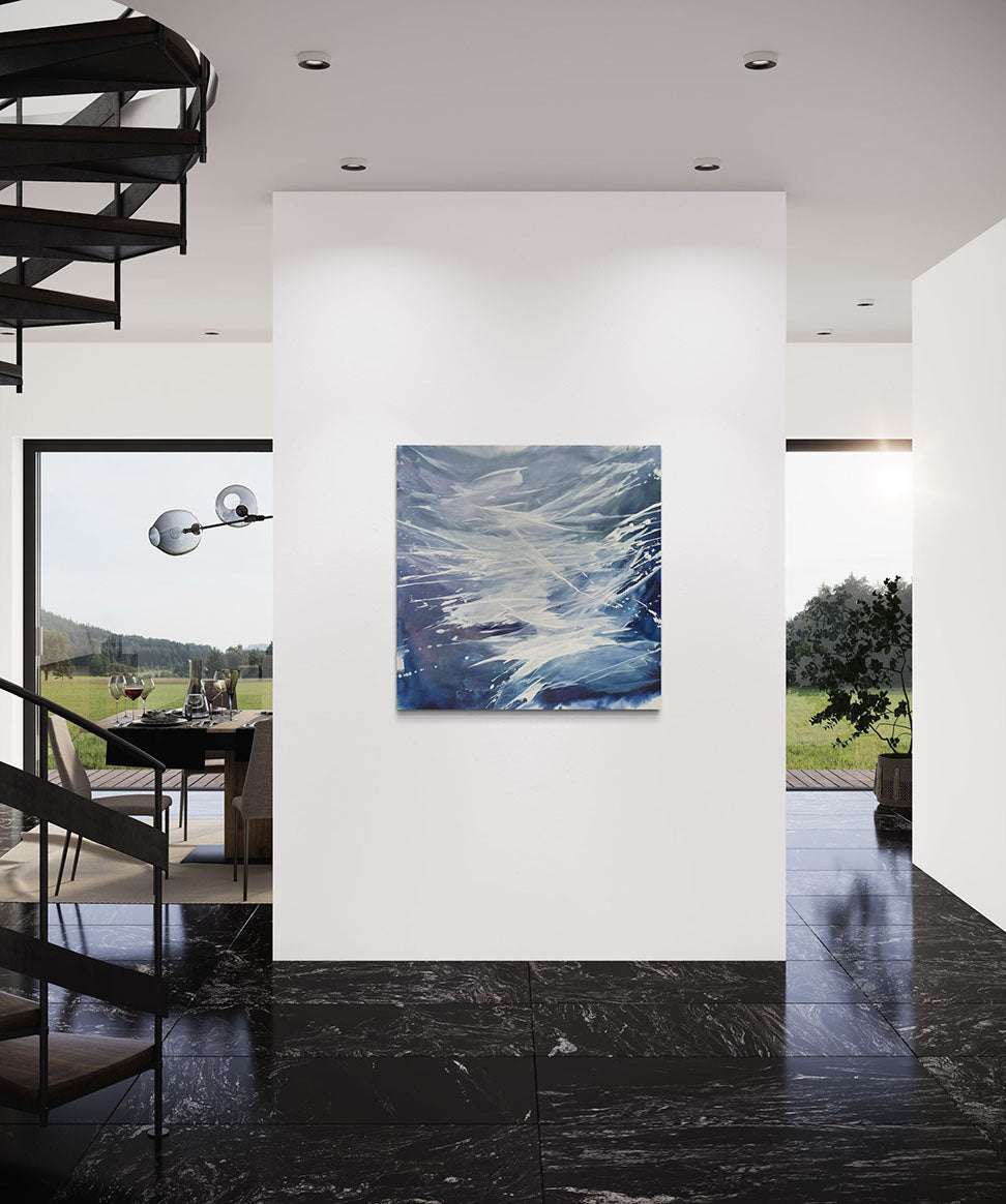 Modern interior with an original artwork featuring abstract blue and white colors with a dynamic wave form, signed by Teodora Guererra.