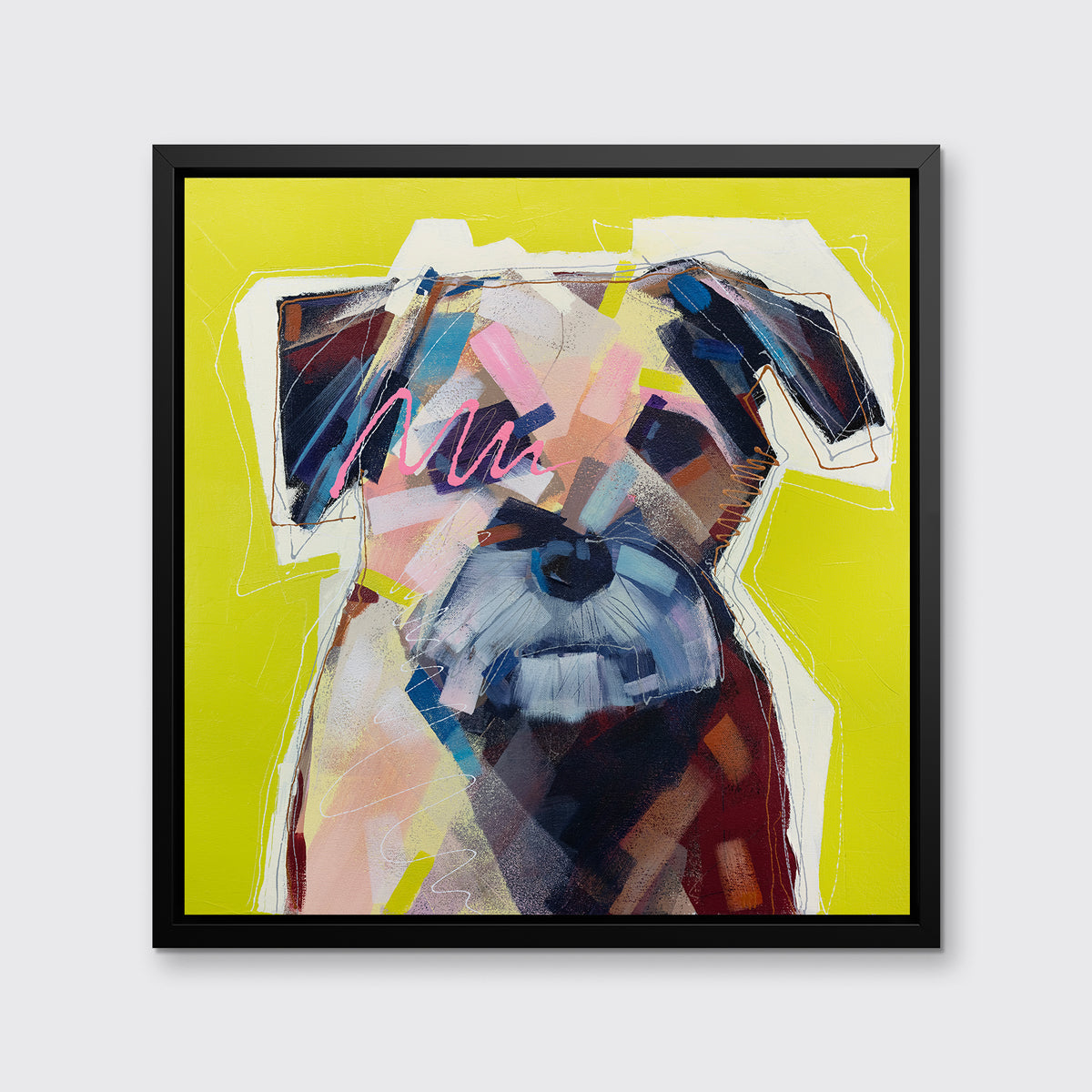 A multicolored abstract dog print in a black floater frame hangs on a white wall.