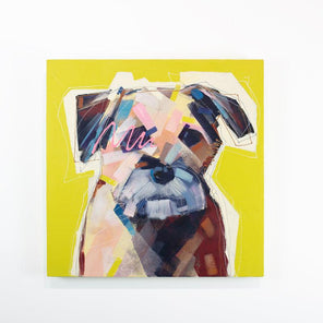 A bright yellow painting of an abstracted dog hangs on a white wall.