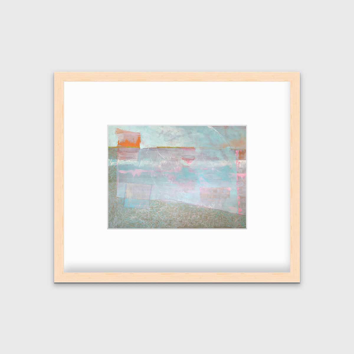 A light blue and pink abstract print in a natural wood frame with a mat hangs on white wall.