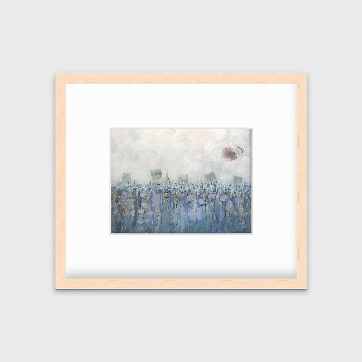 A beige, teal and lavender abstract print in a natural wood frame with a mat hangs on a white wall.