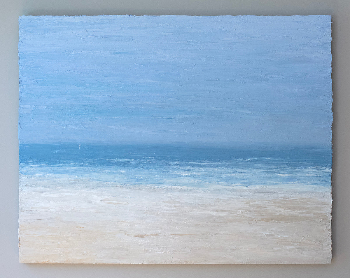 A very thick painted coastal seascape with a loan sailboat hangs on a grey wall.