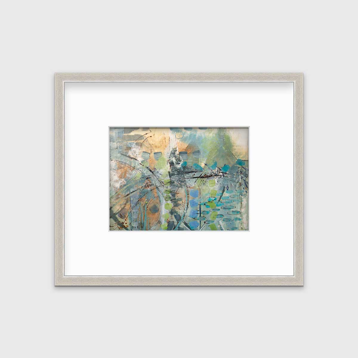 A blue, green, orange and black abstract print in a silver frame with a mat hangs on a white wall.