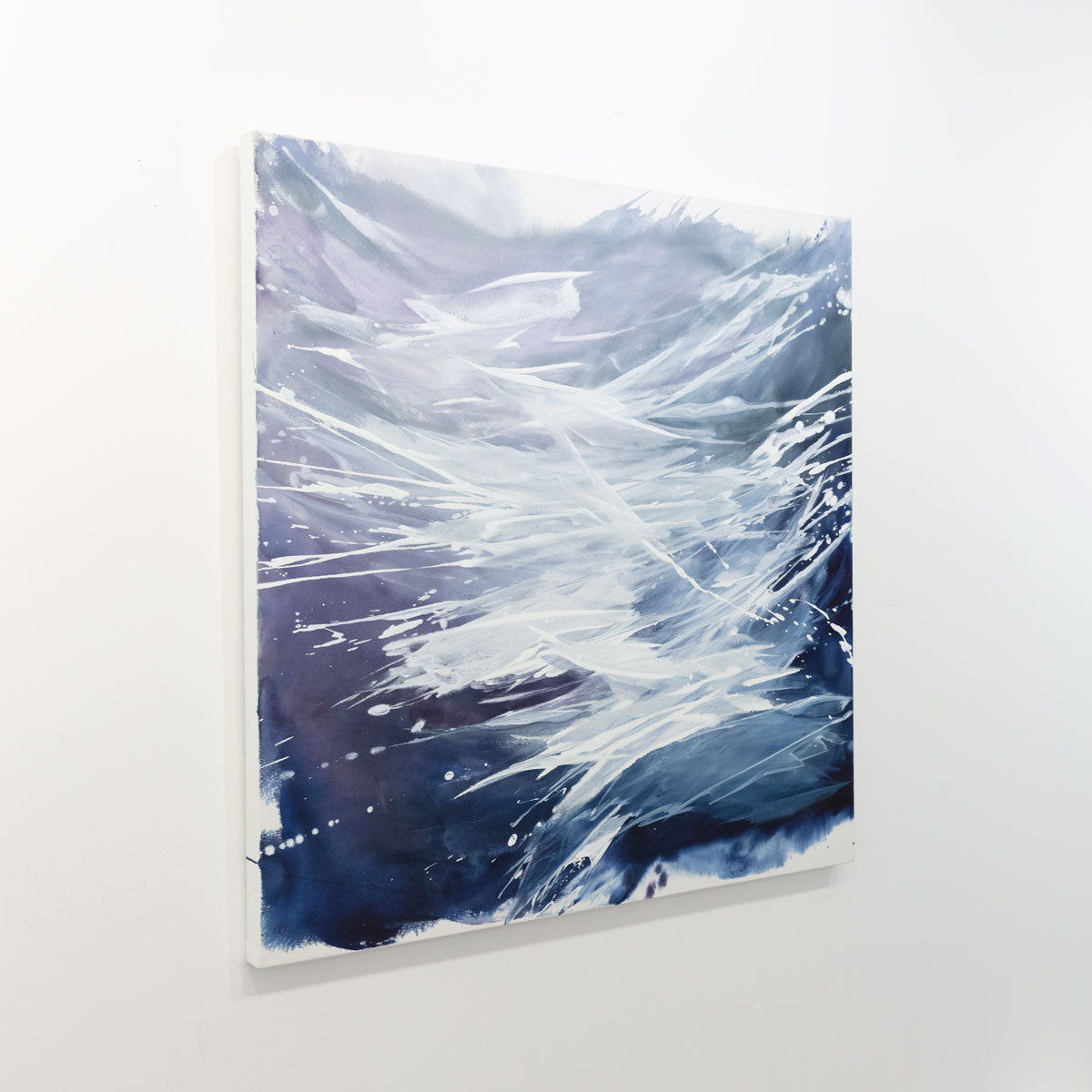 An original abstract painting by Teo Guererra hanging on  white wall.