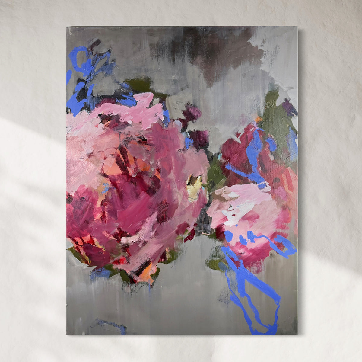 Abstract painting with pink and blue flowers on a gray background