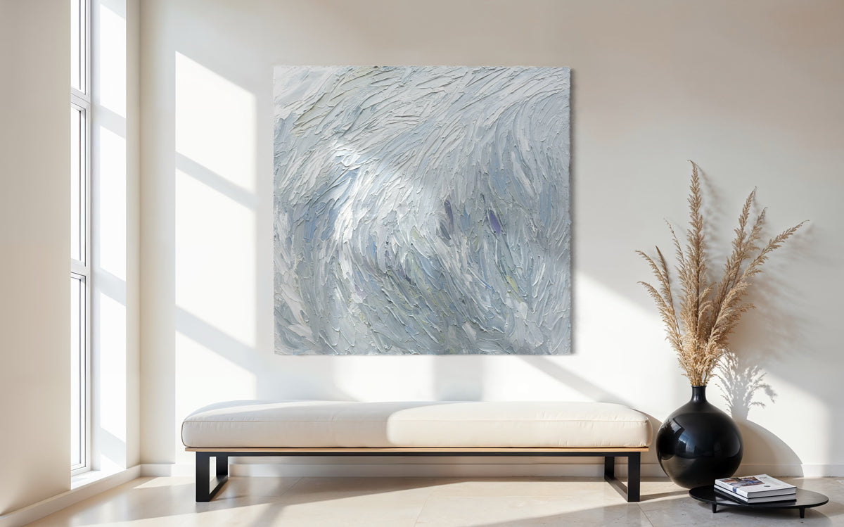 An original abstract painting by Teo Guererra on a wall in a modern living room.