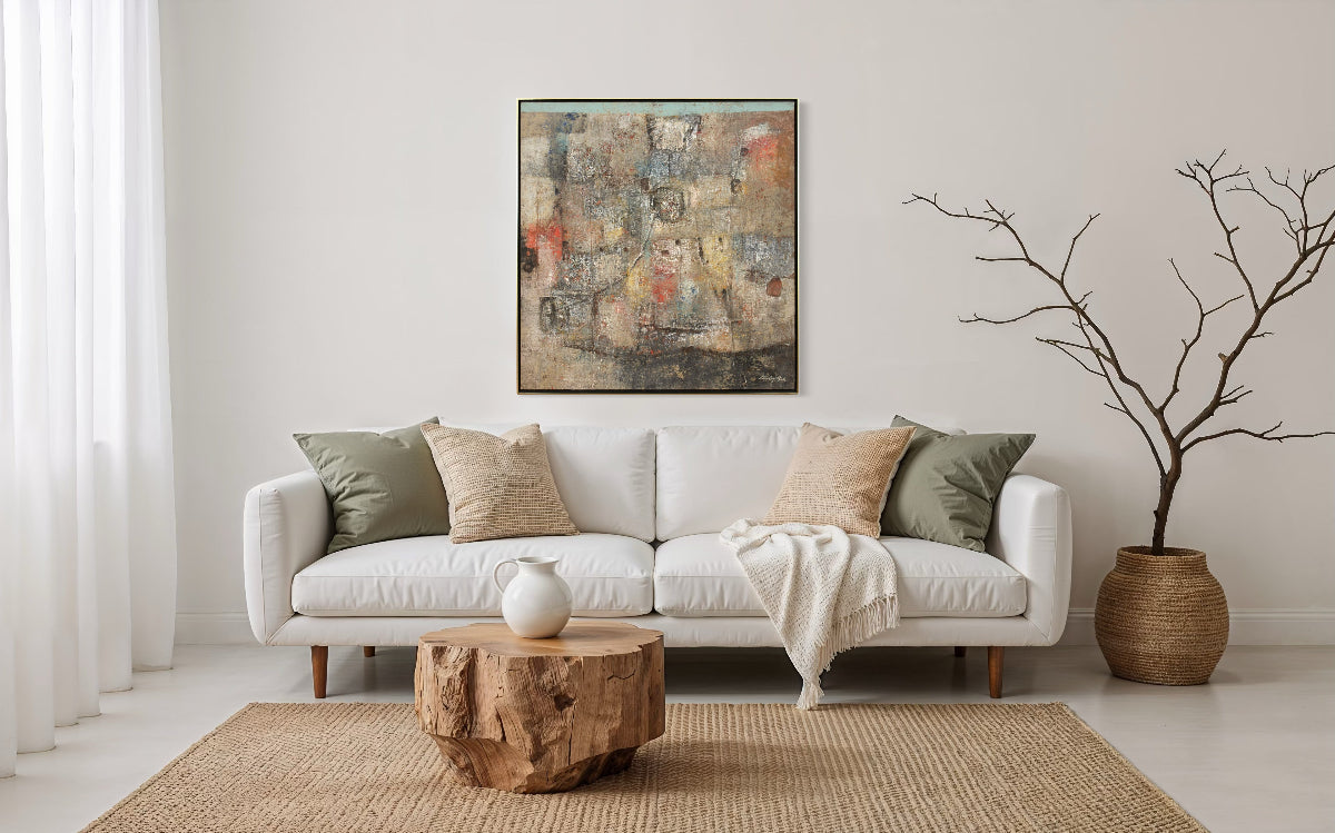 Living room with a white sofa, wooden coffee table, and abstract painting on the wall.