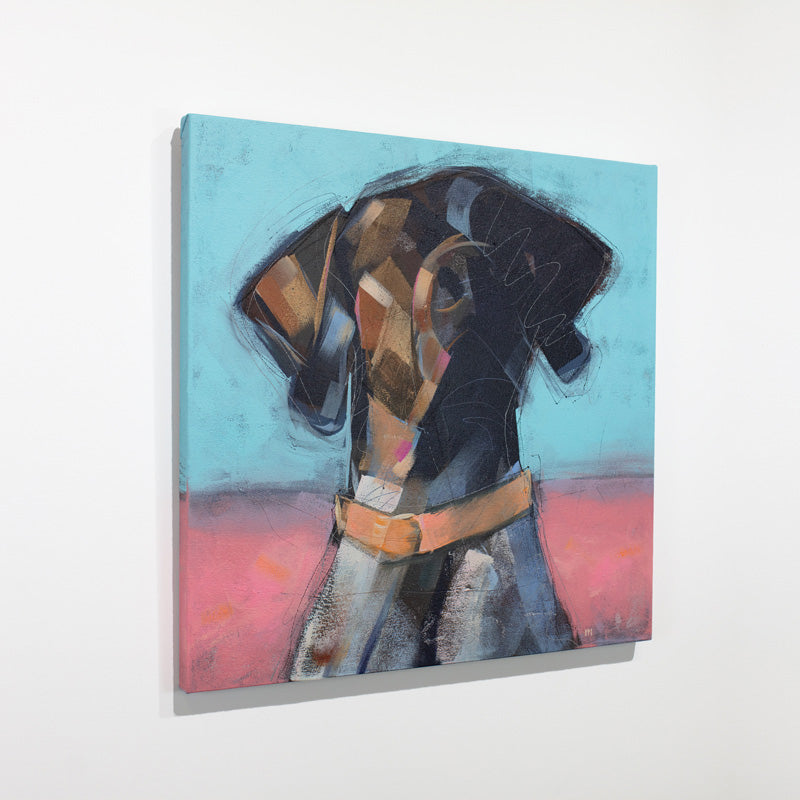 An blue, brown, and pink abstracted painting of a dog hangs on a white wall.