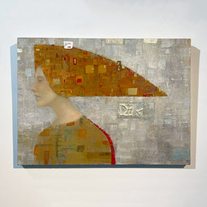 An abstract portrait of a woman in profile. She wears a long orange and gold, triangular head piece. Hangs on a white wall.