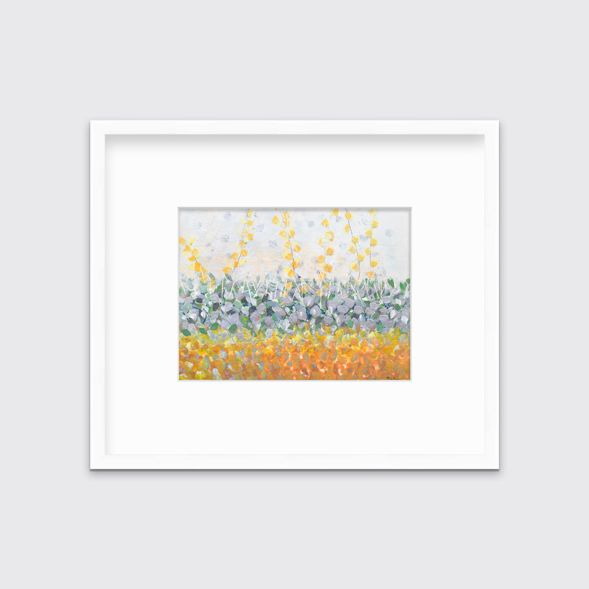 A yellow, purple, green and orange abstract print in a white frame with a mat hangs on a white wall.