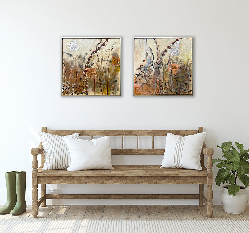 Two framed, nature-inspired encaustic paintings hang a wooden country style bench in a mudroom.