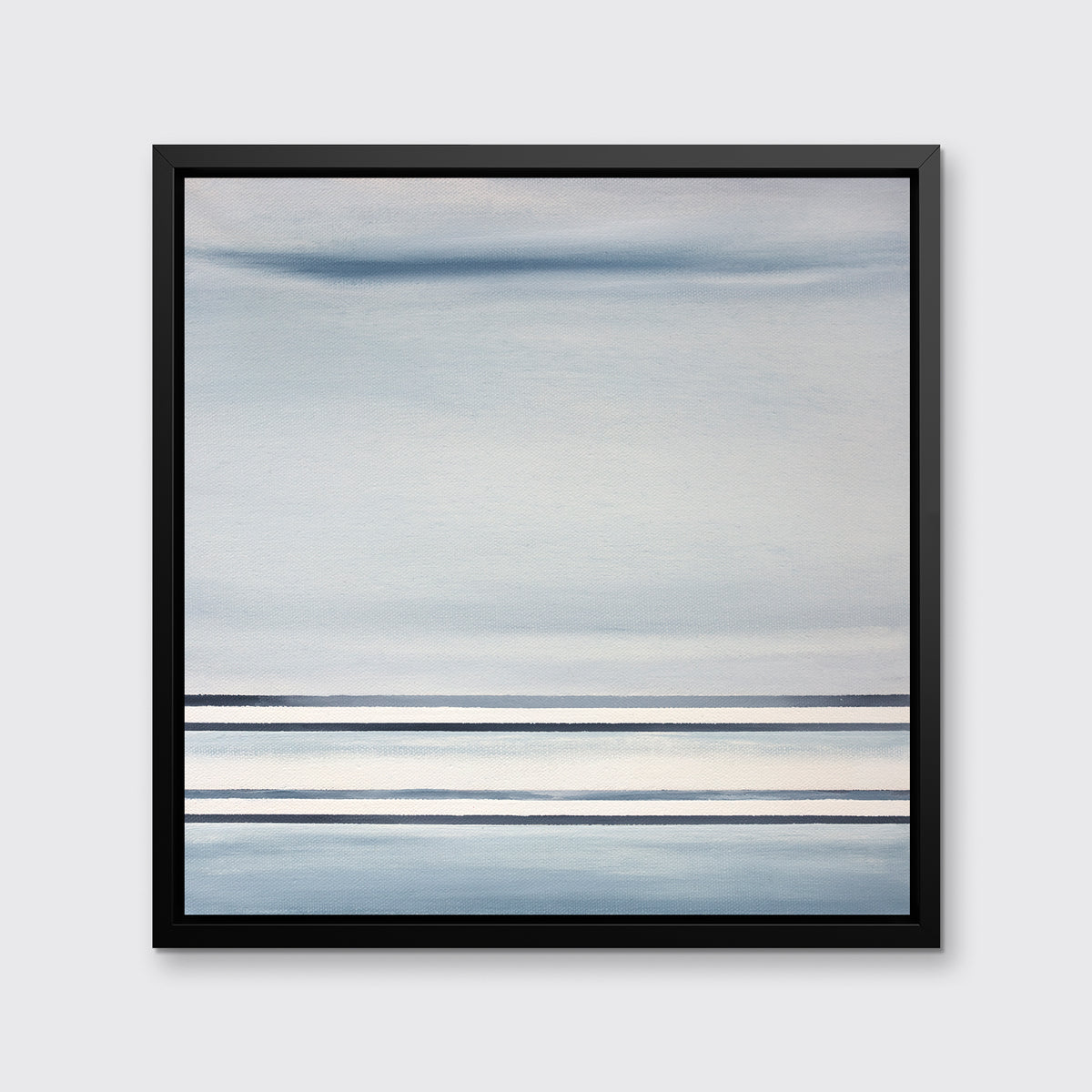 A blue and white linear abstract print in a black floater frame on a white wall.