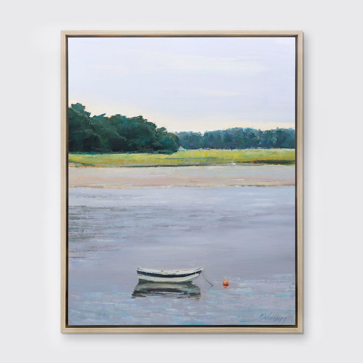 A limited edition landscape print framed in a light wood frame hangs on a white wall.