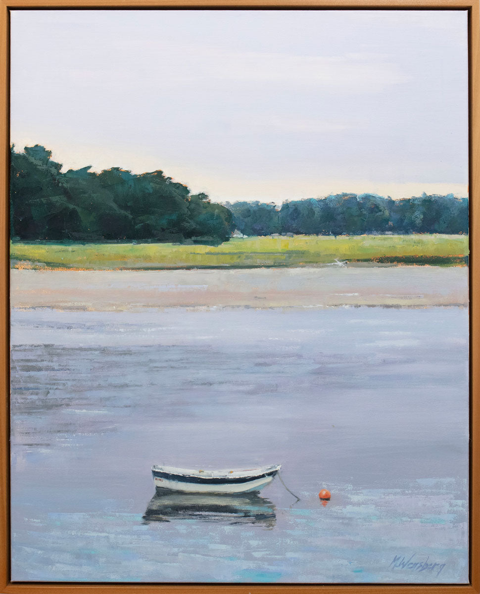 A light coastal landscape painting framed in a light wood frame.