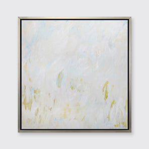 A white, beige and light green abstract print in a silver floater frame hangs on a white wall.